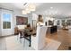 Open floor plan showcasing the kitchen, dining area, and living room filled with natural light and modern finishes at 315 Chiswick Cir # 38, Alpharetta, GA 30009