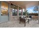 Cozy brick patio featuring a comfortable seating area with neutral colored cushions, perfect for relaxing at 315 Chiswick Cir # 38, Alpharetta, GA 30009