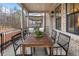 Inviting covered patio features a wood dining table and black metal railing, perfect for outdoor dining at 315 Chiswick Cir # 38, Alpharetta, GA 30009