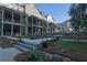 Upscale townhomes with covered porches overlook manicured landscaping at 315 Chiswick Cir # 38, Alpharetta, GA 30009