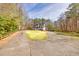 Spacious home with a well-maintained lawn, complemented by a long, paved driveway at 3564 Suwanee Creek Rd, Suwanee, GA 30024