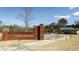 Entrance to Logan Farm Park, featuring a brick sign and playground in the background at 2429 Bayberry St, Acworth, GA 30101