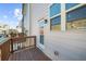 Cozy outdoor deck with wood flooring and railing, perfect for relaxing and enjoying the neighborhood views at 4478 Dunblane Ave, Sugar Hill, GA 30518