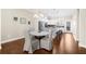 Dining area with hardwood floors and open to the kitchen at 4478 Dunblane Ave, Sugar Hill, GA 30518