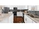 Stylish kitchen features white cabinets, stainless steel appliances, and a double sink at 4478 Dunblane Ave, Sugar Hill, GA 30518