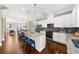 Open concept kitchen with island, stainless steel appliances, and eat-in dining area at 4478 Dunblane Ave, Sugar Hill, GA 30518