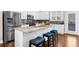 Modern kitchen with granite countertops, stainless steel appliances, and eat-in island at 4478 Dunblane Ave, Sugar Hill, GA 30518