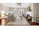 Inviting living room with fireplace, natural light, hardwood floors and comfortable seating at 4478 Dunblane Ave, Sugar Hill, GA 30518