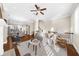 Open living space featuring hardwood floors, natural light, and seamless flow to dining at 4478 Dunblane Ave, Sugar Hill, GA 30518