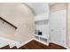 Mudroom features a bench with storage and cubbies and a door to the garage at 4478 Dunblane Ave, Sugar Hill, GA 30518