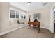 Bright home office with a built-in bench seat by the window providing a functional workspace at 4478 Dunblane Ave, Sugar Hill, GA 30518