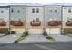 A row of townhomes, each with a garage and upper deck, with modern exteriors at 4478 Dunblane Ave, Sugar Hill, GA 30518