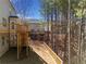 Private backyard features a wooden deck overlooking the serene landscape at 703 Sierra Ct, Canton, GA 30114