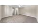 A spacious bedroom features a ceiling fan and a doorway to a closet and bathroom at 703 Sierra Ct, Canton, GA 30114