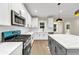 Modern kitchen with stainless steel appliances, a center island, and white herringbone backsplash at 703 Sierra Ct, Canton, GA 30114