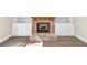 Cozy living room with a brick fireplace and built-in shelving at 703 Sierra Ct, Canton, GA 30114