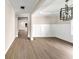 A bright living room features modern finishes, including hardwood floors and decorative trim at 703 Sierra Ct, Canton, GA 30114