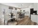 Bright kitchen featuring white cabinets, a center island with seating, and stainless steel appliances at 117 Longhorn Way, Auburn, GA 30102