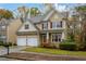 Charming two-story home with stone accents, attached two-car garage, and manicured landscaping at 2501 Fieldview Way, Buford, GA 30519