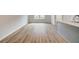 Open kitchen and living area with stainless appliances and wood floors at 3154 Washburn Sw St, Atlanta, GA 30354