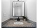 Bright bathroom features a granite vanity, undermount sink, and designer fixtures at 3185 Delhi Dr, Powder Springs, GA 30127