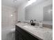Elegant bathroom features a granite vanity, tiled shower, and a bright, clean design at 3185 Delhi Dr, Powder Springs, GA 30127