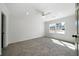 Well-lit bedroom features plush carpet and a large window with scenic outdoor views at 3185 Delhi Dr, Powder Springs, GA 30127