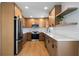 Modern kitchen featuring stainless appliances, light wood cabinetry, and subway tile backsplash at 3185 Delhi Dr, Powder Springs, GA 30127