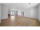 Bright living room with wood flooring and neutral paint, leading to a patio at 3185 Delhi Dr, Powder Springs, GA 30127