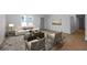 Inviting living room with a stylish rug, neutral sofa, and natural light at 3185 Delhi Dr, Powder Springs, GA 30127