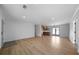 Open-concept living area showcases wood floors and flows into the modern kitchen at 3185 Delhi Dr, Powder Springs, GA 30127