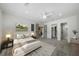 Spacious primary bedroom with neutral tones, plush carpet, and bright lighting at 3185 Delhi Dr, Powder Springs, GA 30127