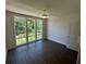 A bright bedroom features hardwood floors and large windows looking out onto nature at 962 Bibbs Circle # 5, Atlanta, GA 30318