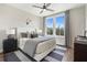 Comfortable bedroom with a platform bed, soft lighting, and large windows at 962 Bibbs Circle # 5, Atlanta, GA 30318
