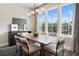 Beautiful dining room with large windows and a modern light fixture above the table at 962 Bibbs Circle # 5, Atlanta, GA 30318