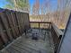 Balcony view featuring wood decking and dark metal chairs for outdoor relaxation at 2256 Triple Crown Ln, Lithonia, GA 30058