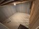 Unfinished basement area with poured concrete walls and exposed ceiling rafters at 2256 Triple Crown Ln, Lithonia, GA 30058