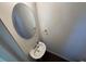 Powder room features a pedestal sink, oval mirror, and brushed fixtures at 2256 Triple Crown Ln, Lithonia, GA 30058