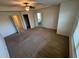 Spacious bedroom with carpet flooring, ceiling fan, walk-in closet, and ensuite bathroom at 2256 Triple Crown Ln, Lithonia, GA 30058