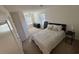 Cozy bedroom with neutral carpet, dresser, and bed with decorative pillows at 2256 Triple Crown Ln, Lithonia, GA 30058