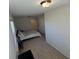 Bedroom featuring carpet, window, closet, and a cozy bed with decorative pillows at 2256 Triple Crown Ln, Lithonia, GA 30058