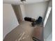 Upstairs bonus room with carpet, a TV, rolling chair, and natural light from the window at 2256 Triple Crown Ln, Lithonia, GA 30058
