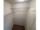 Walk-in closet with carpeted floor and multiple wire shelves for optimal storage at 2256 Triple Crown Ln, Lithonia, GA 30058