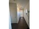 Hallway with hardwood floors and a modern floor lamp at 2256 Triple Crown Ln, Lithonia, GA 30058