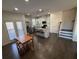 Eat-in kitchen featuring stainless appliances, granite counters, island and dark hardwood floors at 2256 Triple Crown Ln, Lithonia, GA 30058