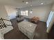 Open living space featuring kitchen island, hardwood floors, and a large dining table at 2256 Triple Crown Ln, Lithonia, GA 30058