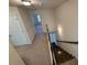 Bright stairway with wood stairs and white trim leads to an upper level at 2256 Triple Crown Ln, Lithonia, GA 30058