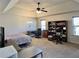 Bedroom with a vaulted ceiling, ceiling fan, and lots of natural light, featuring a large bookcase at 2359 Brynfield Cv, Suwanee, GA 30024