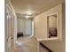 Upstairs hallway featuring neutral carpeting and lighting, with access to multiple rooms at 2359 Brynfield Cv, Suwanee, GA 30024