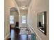 Inviting hallway features hardwood floors, an elegant mirror, and a bright front door at 2359 Brynfield Cv, Suwanee, GA 30024